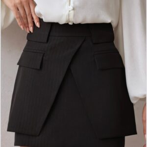 Woman wearing white blouse and black skirt.